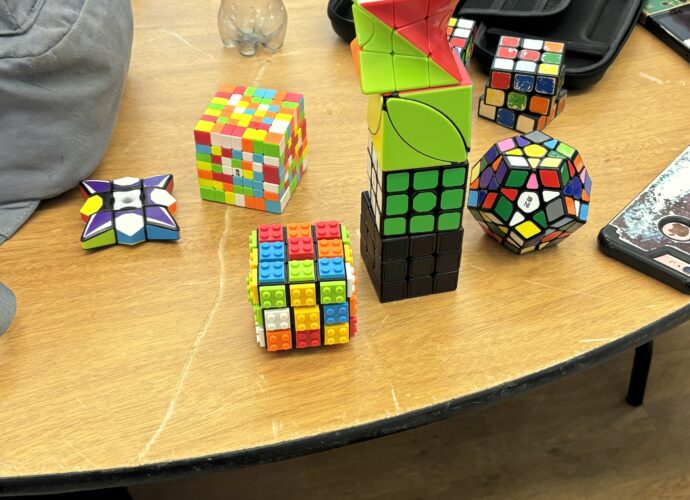 An array of all sorts of "rubix" style cubes in all different colours.