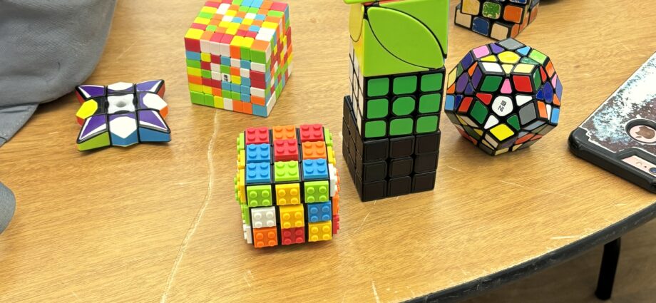 An array of all sorts of "rubix" style cubes in all different colours.