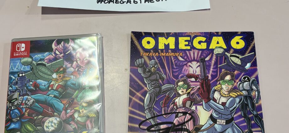 a picture of the hard copy of Omega 6, the signed manga book, and a handwritten note from the developers.