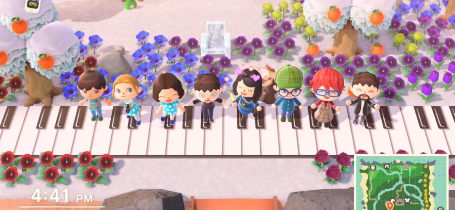 a group photo of 8 of us in Animal Crossing, posing on piano tiles with flowers in the background